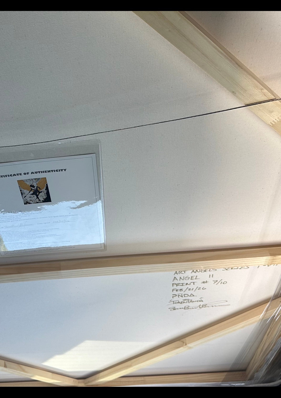 Close-up of a framed document with a glass cover