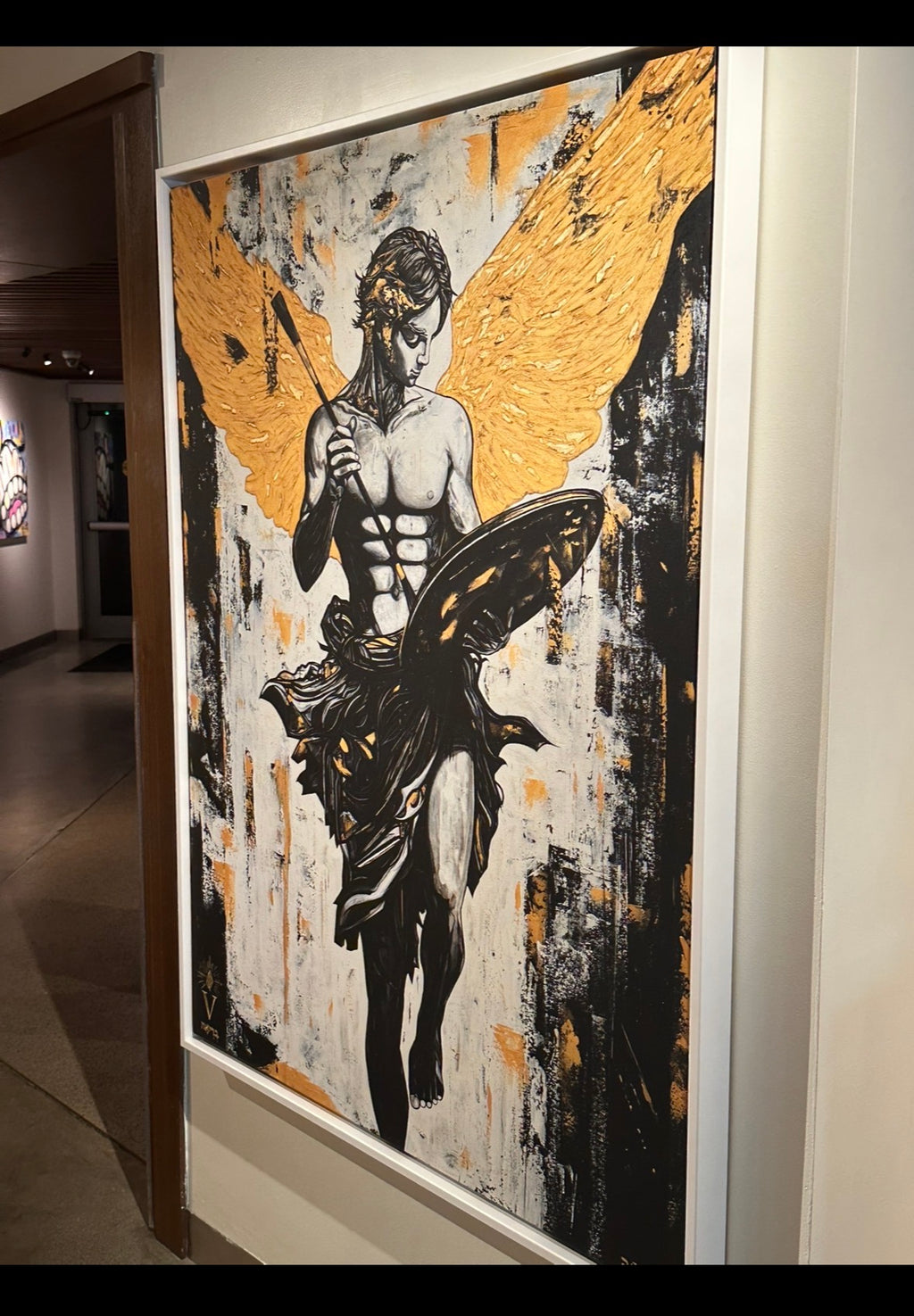 Artistic depiction of a winged figure with gold and black details on a textured background.