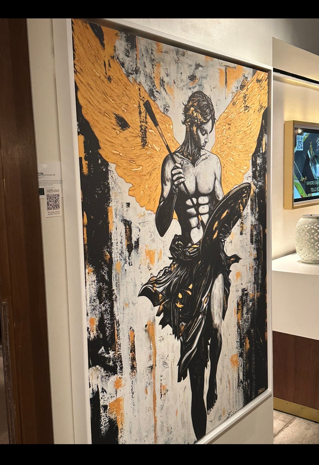 Artistic depiction of a figure with wings in a room setting